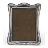 Embossed silver easel photo frame, London 1986, 24.5cm x 19.5cm wide : For Further Condition Reports