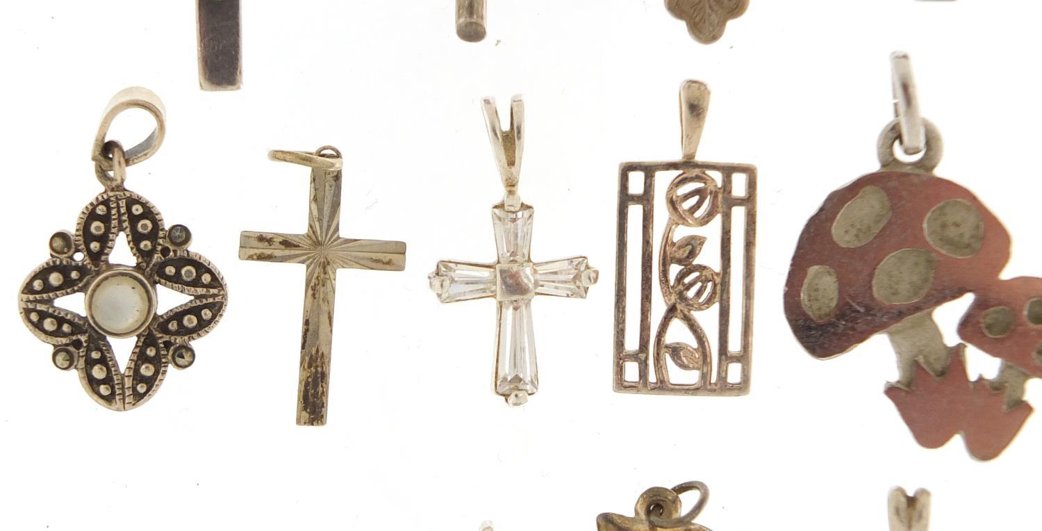 Twenty two silver pendants including crucifixes and love hearts, the largest 5.5cm in length, 39. - Image 4 of 8