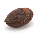 18th century coquilla nut snuff box carved with a male and female, 8.5cm in length : For Further