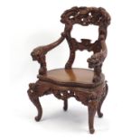 Japanese hardwood armchair carved with dragons, 98cm high : For Further Condition Reports Please