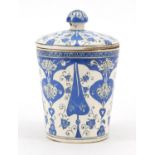 Turkish Iznik pottery jar and cover, hand painted with stylised flowers, 19.5cm high : For Further