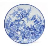 Japanese blue and white porcelain charger hand painted with a bird amongst tree and flowers, 47cm in