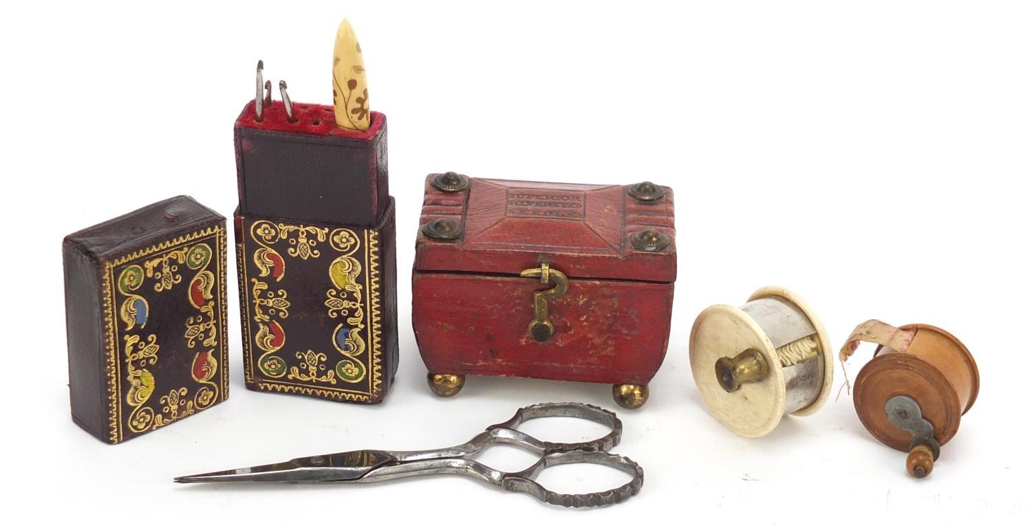 19th century sewing items comprising a tooled leather needle case in the form of a tea caddy,