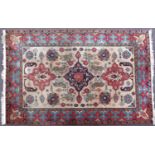 Rectangular Persian rug having an all over floral design, 341cm x 219cm : For Further Condition