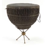 North West Indian ladakh drum with vellum skin and knotted sinew binding on a brass tripod stand,