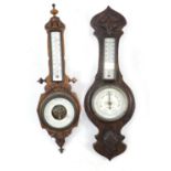 Two wall barometers including a carved walnut example with enamelled thermometer, 49cm high : For