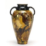 Art Nouveau pottery vase with twin handles, decorated with a maiden stamped Rembrandt and incised