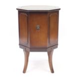 Mahogany octagonal cellarette with tooled leather insert on tapering legs, 70cm high x 45.5cm in