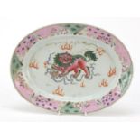 Chinese porcelain oval dish, finely hand painted in the famille rose palette with a Buddhistic