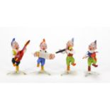 Four novelty hand blown glass musicians, the largest 6.5cm high : For Further Condition Reports,