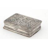 Continental unmarked silver snuff box with hinged compartment to the base, the hinged lid embossed