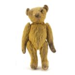 Antique Golden straw filled teddy bear with jointed limbs, 34cm high : For Further Condition