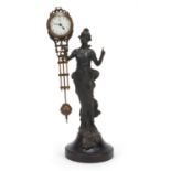 Art Nouveau style bronzed maiden design mystery clock with enamel dial having Arabic numerals,