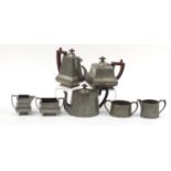 Art Deco lion pewter tea and coffee service and a Mayflower pewter three piece tea service, the