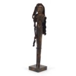 Indonesian tribal interest ancestor staff in the form of a figure emanating from the mouth of a