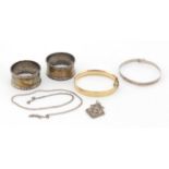 Silver and costume jewellery comprising a pair of silver napkin rings, silver bangle, silver pendant