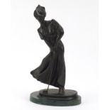 Patinated bronze figure of golfer, raised on a green marble base, 33cm high : For Further