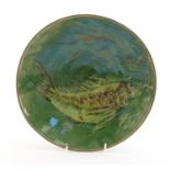 Green glazed fish design pottery wall plaque, inscribed to the reverse Saluce la Barbel?, 28cm in