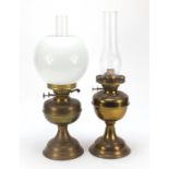 Two brass oil lamps including one with white opaque glass shade, the largest 51cm high : For Further