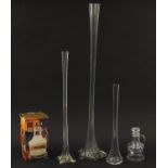 Three tall lily glass vases and a boxed crystal clear glass sugar and cream set, the largest 99.