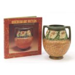 American Roseville art pottery vase with twin handles and an art pottery book by Barbara A Perry,