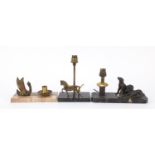 Three French Art Deco marble desk lamps mounted with bronzed dogs, a horse and a swan, the largest