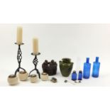 Sundry items including candles, blue glass bottles and studio figure group, the largest 42cm