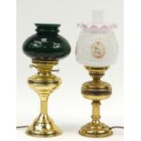 Two brass oil lamps with reeded columns and glass shades, both converted to electric use, the