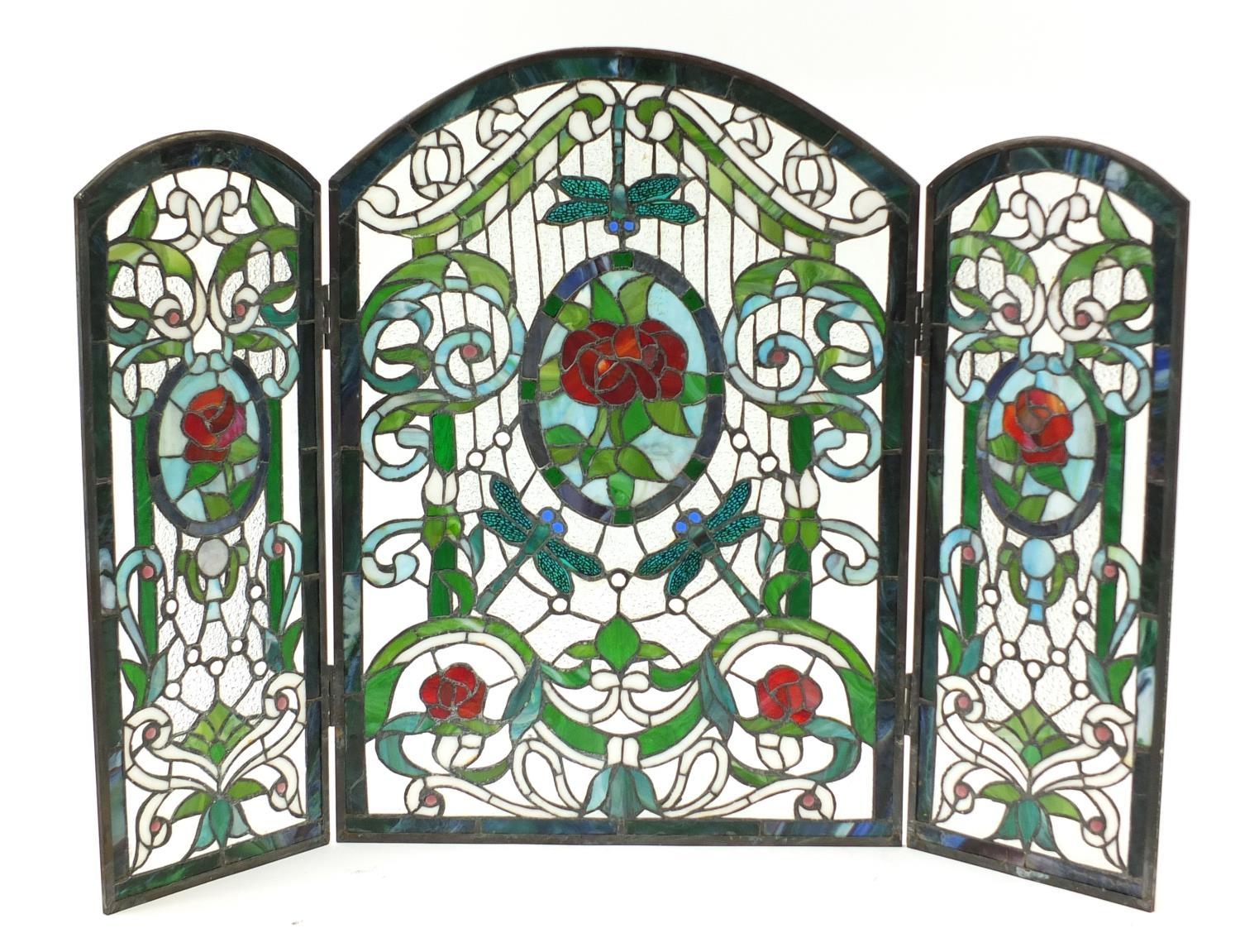 Leaded stained glass three fold screen with Art Nouveau floral roundels, 72cm high x 51cm wide