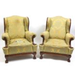 Pair of George II style wingback armchairs with green and gold floral upholstery, 95cm high : For