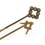 9ct gold Masonic stick pin and a 9ct gold seed pearl stick pin, the largest 5.8cm in length, 1.