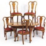 Walnut Dining suite comprising extending dining table with leaf and five chairs with shell carved