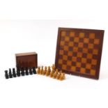 Early 20th century ebony and fruit wood chess set, height of the king 11cm, complete with chess