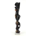 Modernist wood sculpture of a nude female raised on a faux marble base, 50cm high : For Further