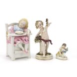 Three continental porcelain figures including a pot and cover in the form of a child seated in a