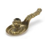 Arts and Crafts bronzed chamber stick with green man design handle, 26cm in length : For Further