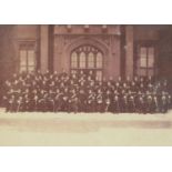 Military interest black and white photograph of a Regiment in full regalia, the front row