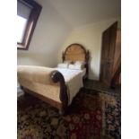 Victorian mahogany Gothic style bed with domed headboard and gold coloured upholstered head and foot
