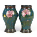 Pair of Japanese cloisonné vases, each enamelled with butterflies amongst blossoming flowers, 22cm