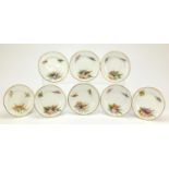 Set of eight Victorian Worcester desert plates hand painted with flowers within gilt borders, each