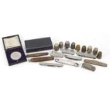 Objects including thimbles, sterling silver flanked pocket tool and commemorative medallion with