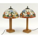 Matched pair of light oak table lamps with Tiffany design floral shades, each 50cm high : For