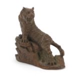 Japanese patinated bronze tiger standing on rocks, impressed character marks to the underside, 6cm