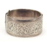 Large Victorian style silver bangle with engraved decoration, S & P, Birmingham 1964, 6.5cm wide,