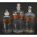 Three 19th century glass Chemist's apothecary jars including Pacaciae, one with J Cox & Son paper