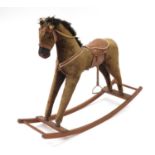 Early 20th century rocking horse, possibly straw filled, 79cm H x 106cm in length : For Further