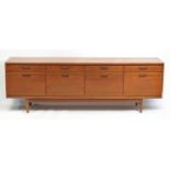 1970's sideboard fitted with four drawers above four cupboard doors, 233.5cm W x 78cm H x 46cm D :