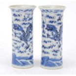 Pair of Chinese blue and white porcelain vases, each hand painted with dragons chasing a flaming