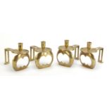 Set of four Arts & Crafts brass candlesticks in the style of C F A Voysey, 15cm high : For Further