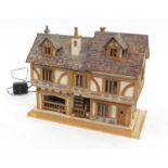 Hand built Elizabethan design doll's house with furniture and wires for lights, 35cm H x 44cm W x